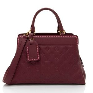Louis Vuitton: Burgundy Monogram Empreinte Vosges MM satchel